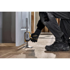 DEWALT construction jack lifting drywall in place to speed installation and reduce strain