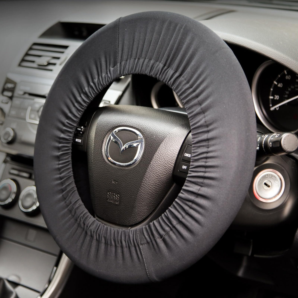 Disklok front view of black steering wheel cover protects wheel finish