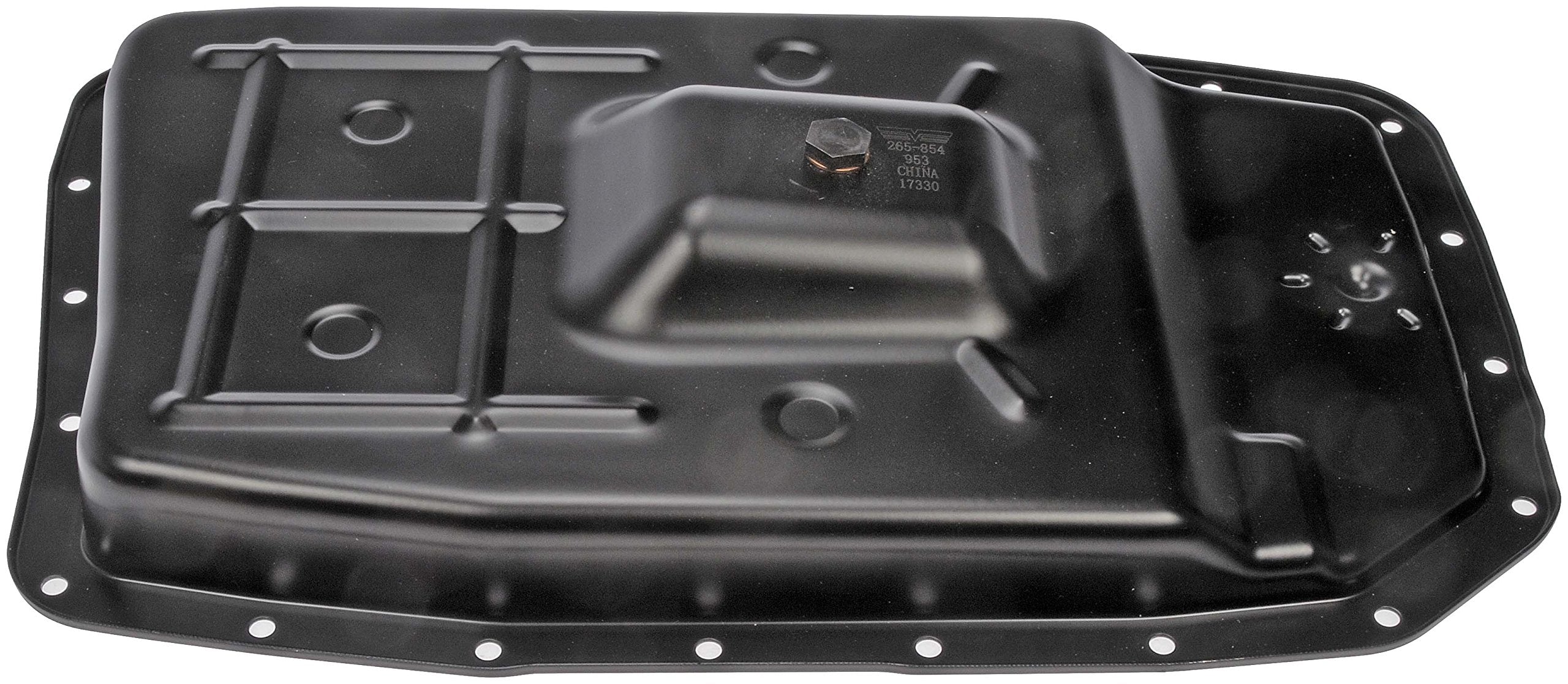 Dorman transmission pan beside ruler for size and scale comparison