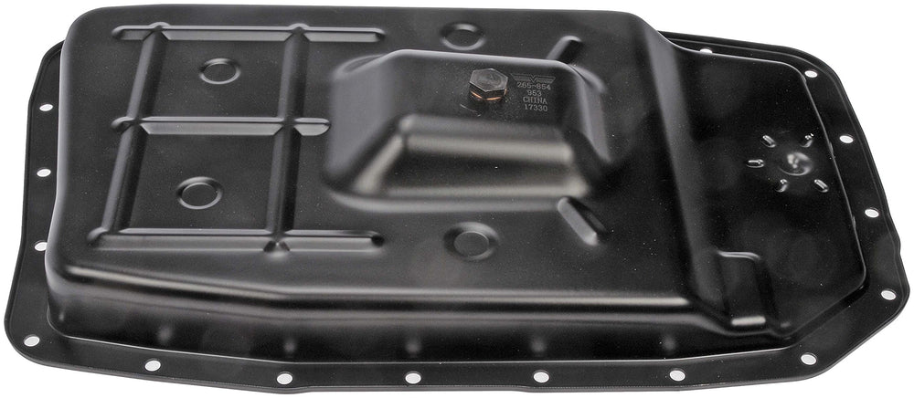 Dorman transmission pan beside ruler for size and scale comparison