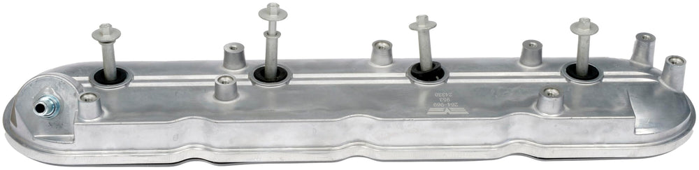 Dorman valve cover next to ruler showing size and fit verification