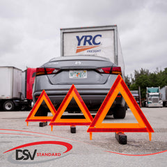 DSV Standard in-use roadside setup with triangles placed ahead of stopped vehicle for warning