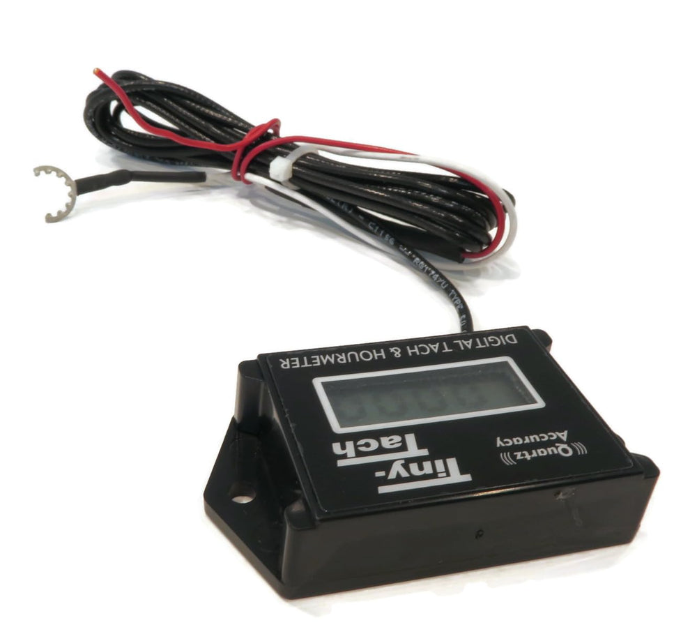 DTI Tiny Tach TT2B next to a ruler showing compact size for tight spaces