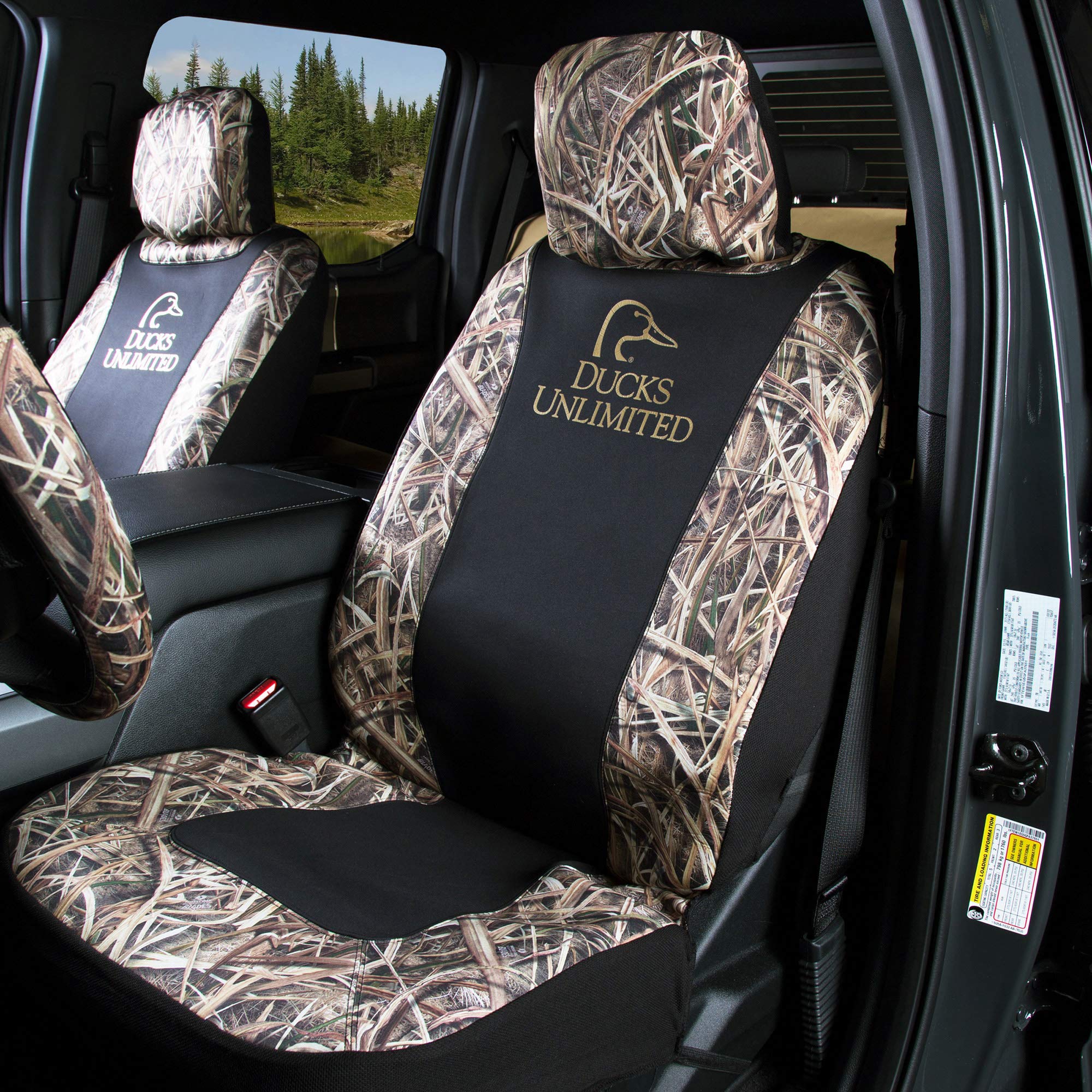 Ducks Unlimited seat cover installed in truck during outdoor hunting trip