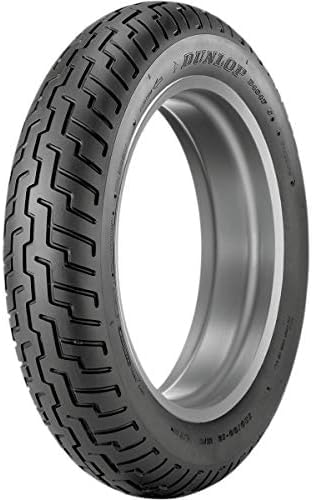 close-up of DUNLOP D404 tread pattern emphasizing water evacuation benefit