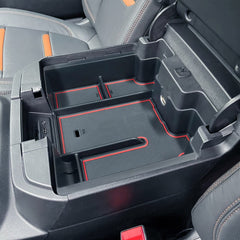 EDBETOS rear cable pass-through allowing charger routing and neat cables