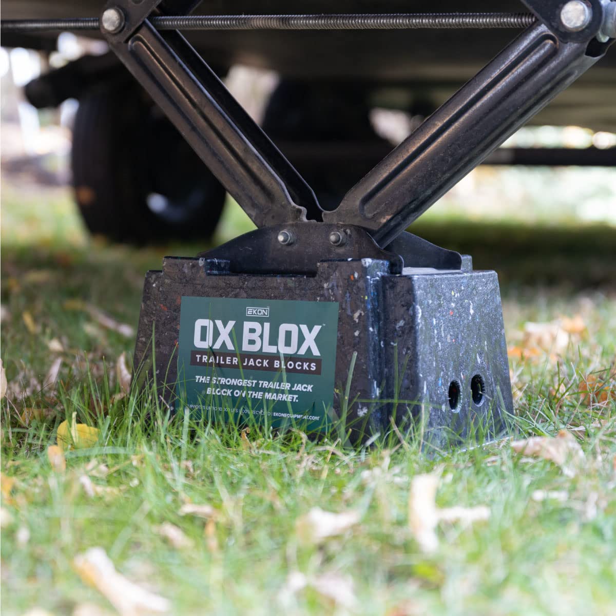 EKON OX BLOX beside an RV at campsite illustrating reliable leveling benefit