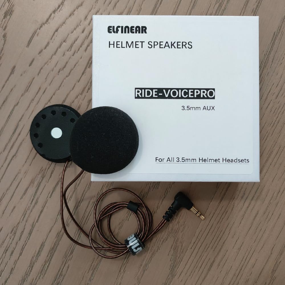 ELFINEAR speaker beside helmet for scale to show compact size and easy installation