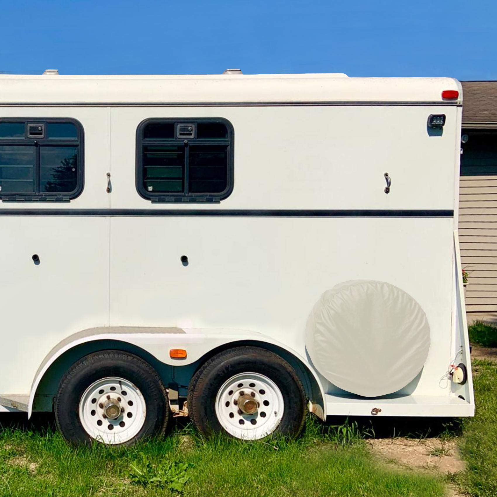 Explore Land mounted on RV spare tire demonstrating all-season protection