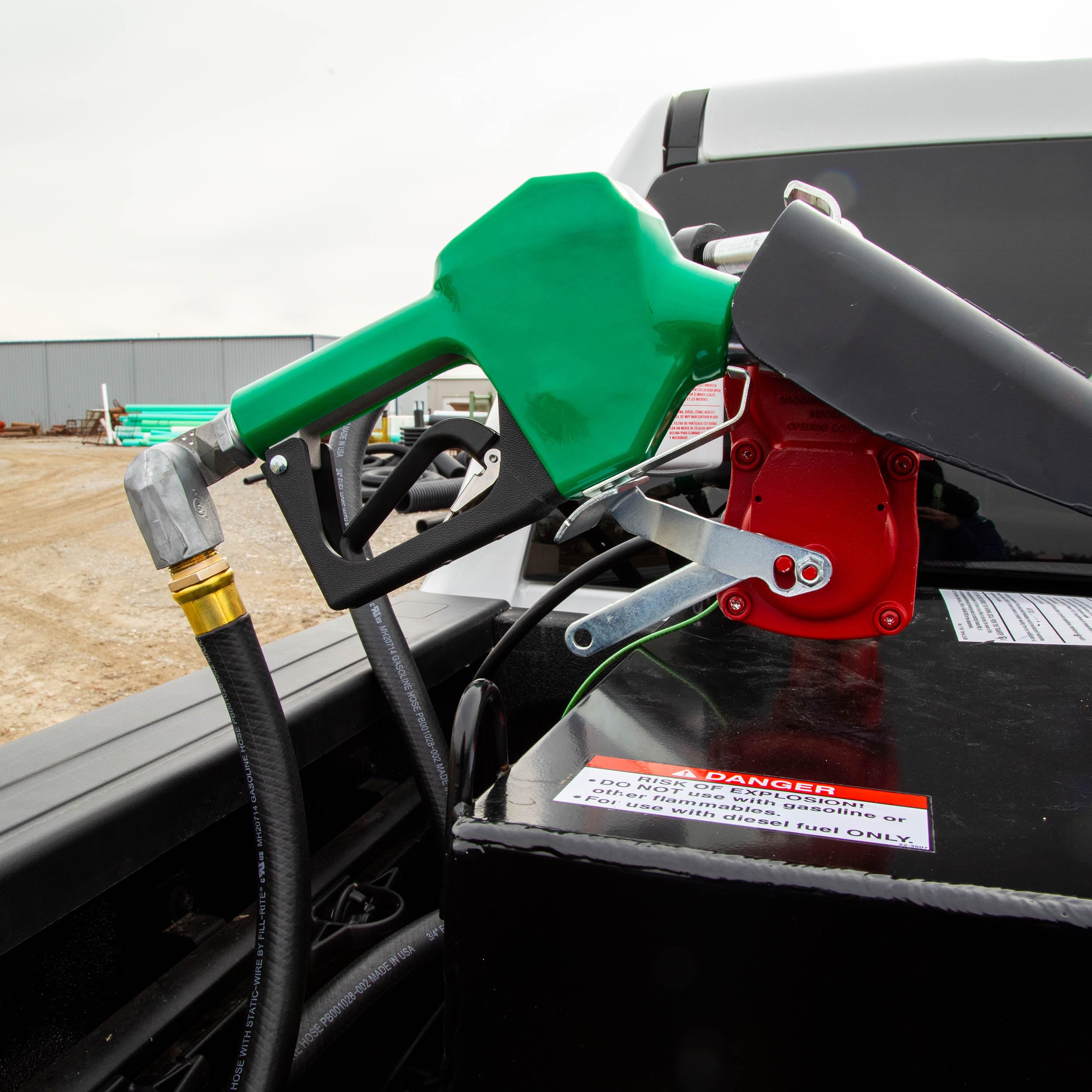 Fill-Rite nozzle in use at tank illustrating automatic shutoff activation and safety