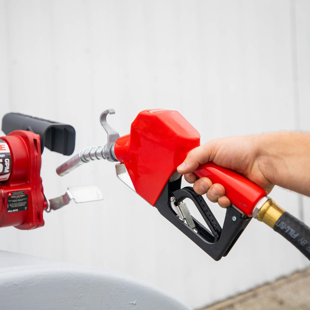 Fill-Rite nozzle beside a ruler for scale to show size and 3–15 GPM capacity