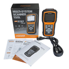 FOXWELL NT530 held in a technician hand demonstrating ergonomic design and ease of use