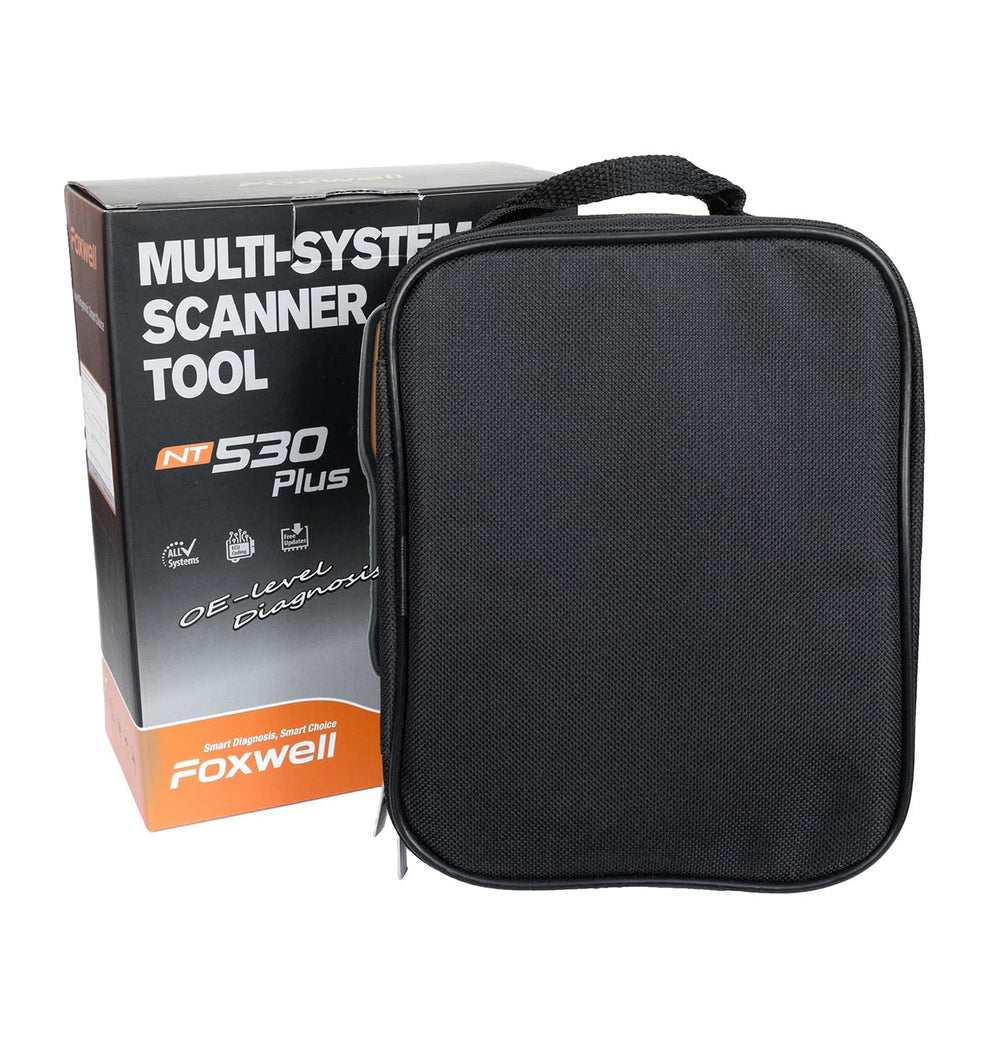 FOXWELL NT530 connected to a Porsche on a lift illustrating professional in-garage maintenance capability