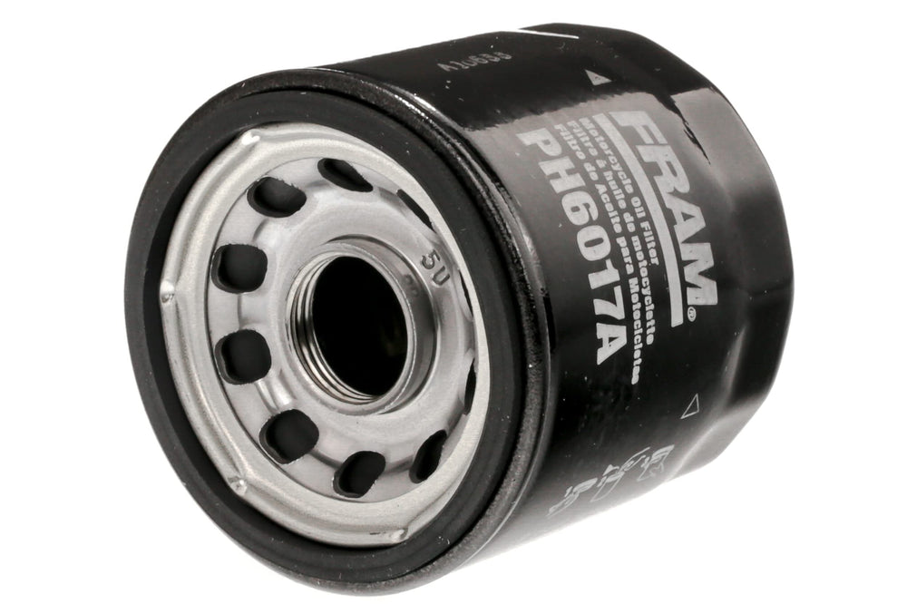 Fram PH6017A installed on motorcycle oil filter housing demonstrating quick service