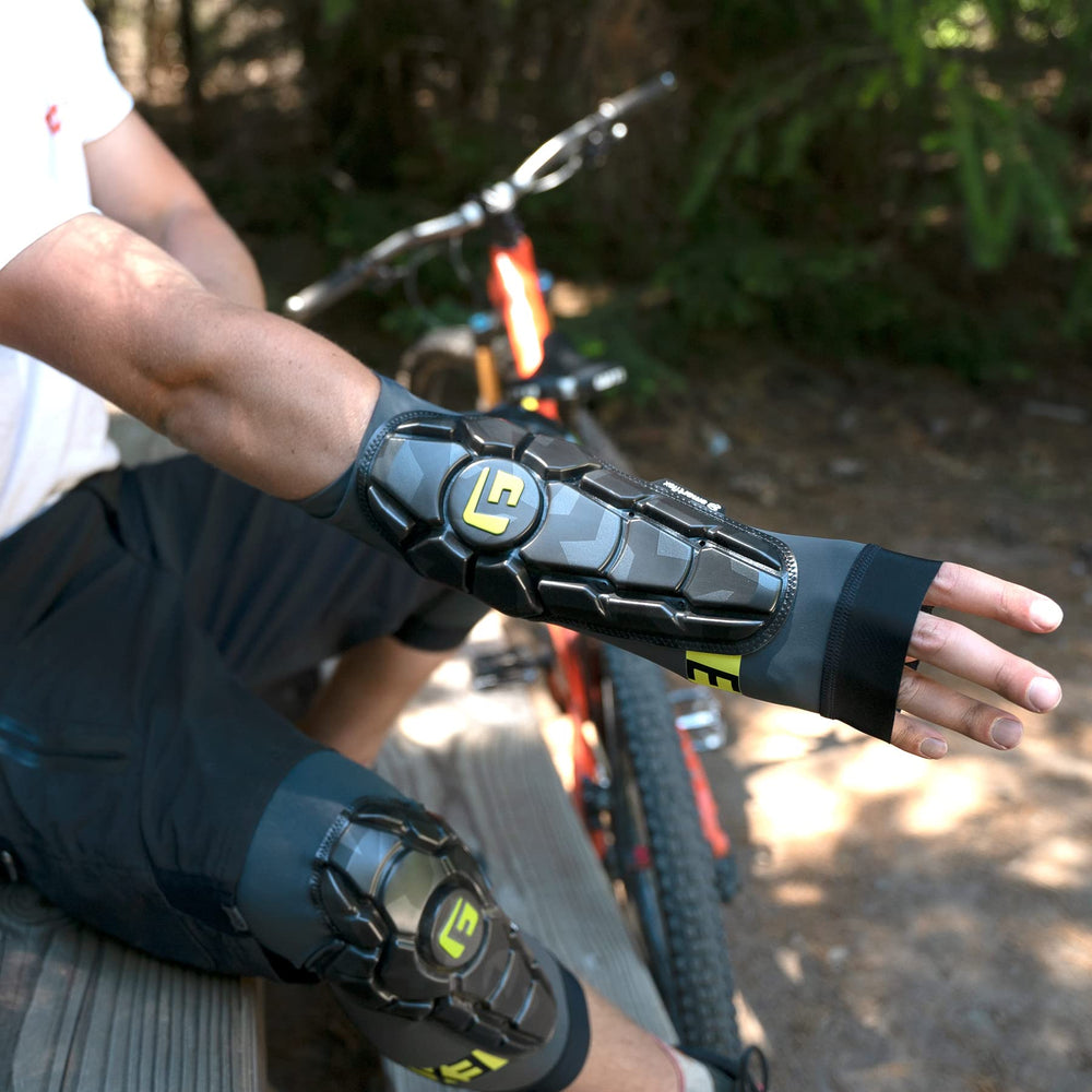 G-Form Pro-X3 worn by youth riding mountain bike demonstrating secure protection benefit