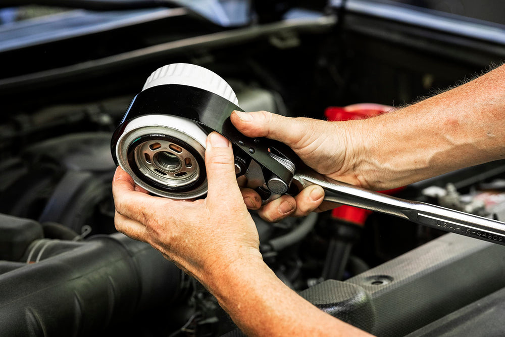 GEARWRENCH wrench removing a truck filter demonstrating practical use benefit