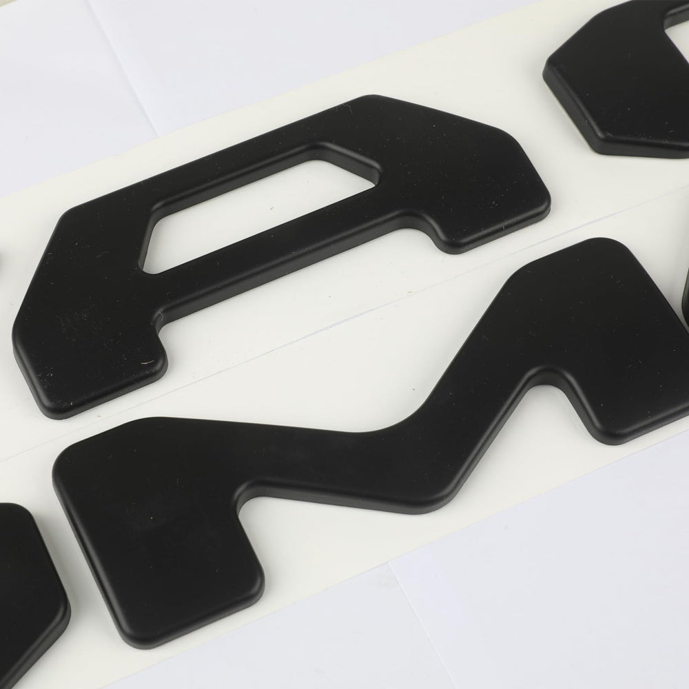 Generic brand installed letters on Tacoma tailgate demonstrating raised look