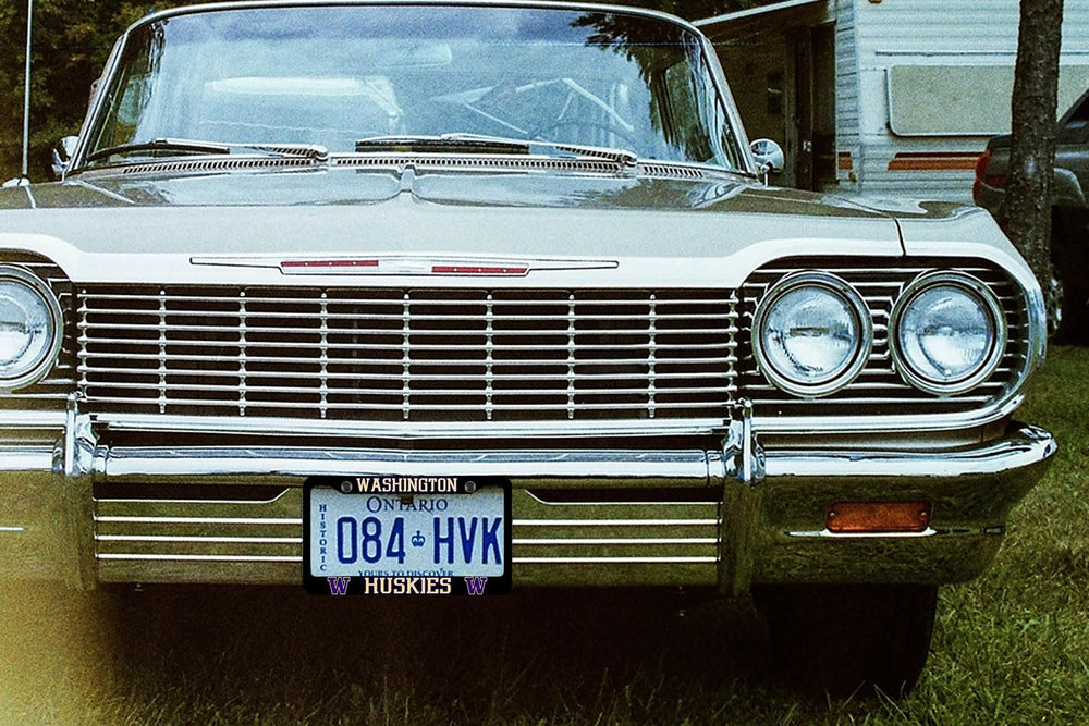 Generic brand frame installed on vehicle front showing improved style and secure mounting