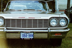 Generic brand frame installed on vehicle front showing improved style and secure mounting