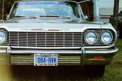 Generic frame installed on a sedan displaying team pride and clean vehicle styling
