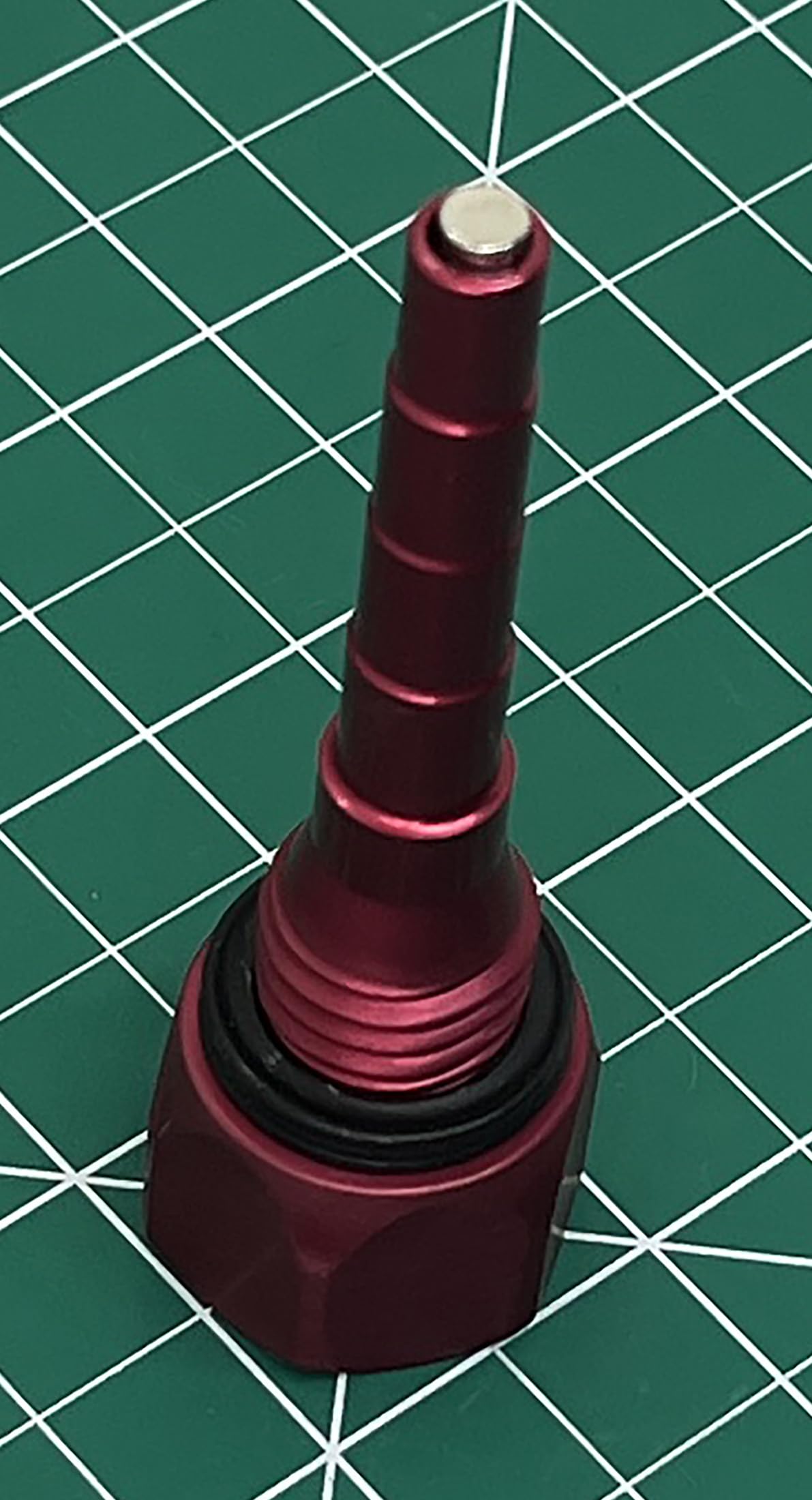 GenExhaust dipstick beside ruler showing size and scale for fit confirmation
