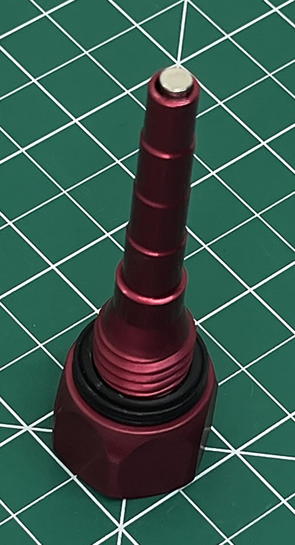 GenExhaust dipstick beside ruler showing size and scale for fit confirmation