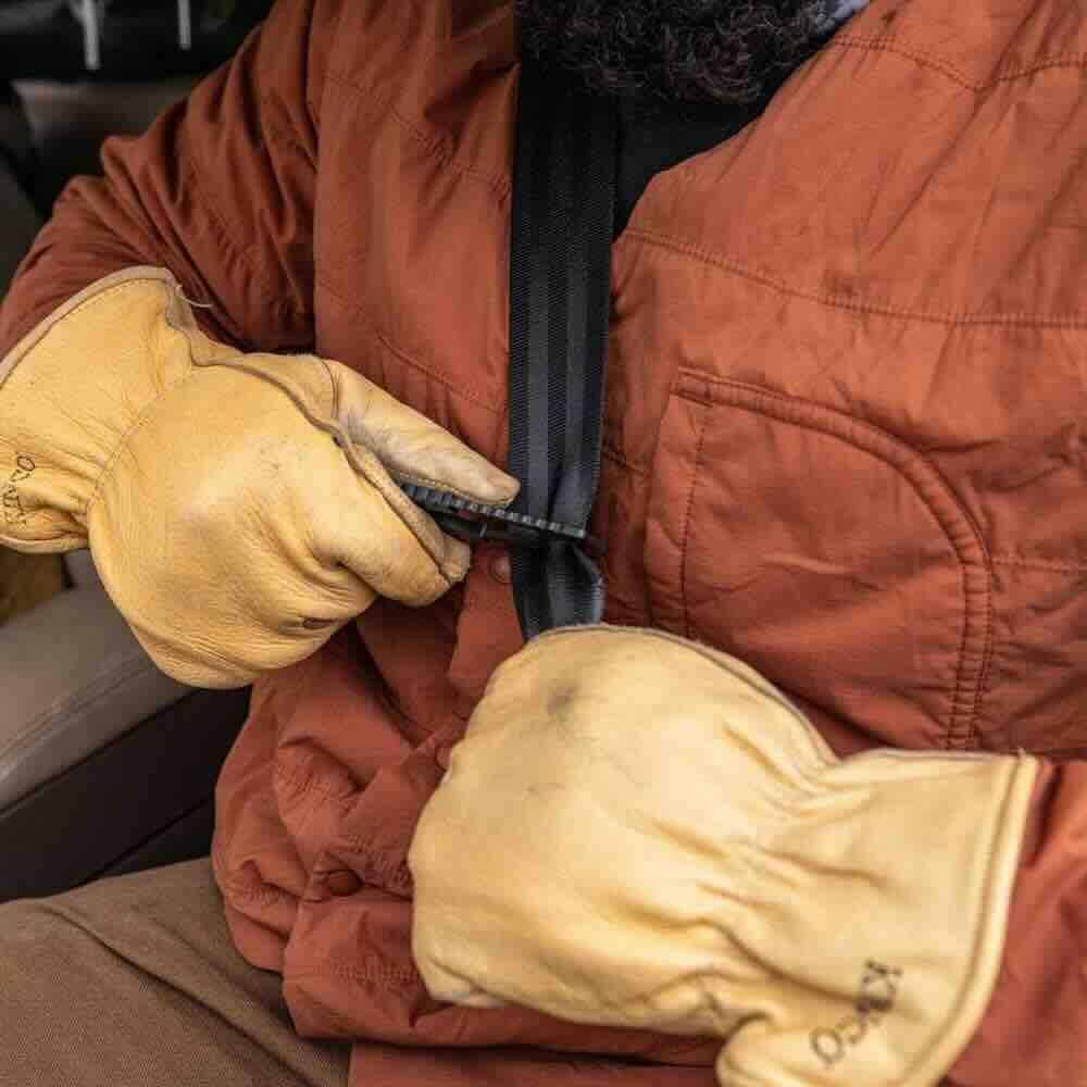 Gerber mounted inside car on visor showing immediate access benefit