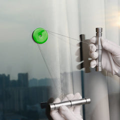 Gomake tool lifting vinyl around a car badge showing tidy tuck benefit