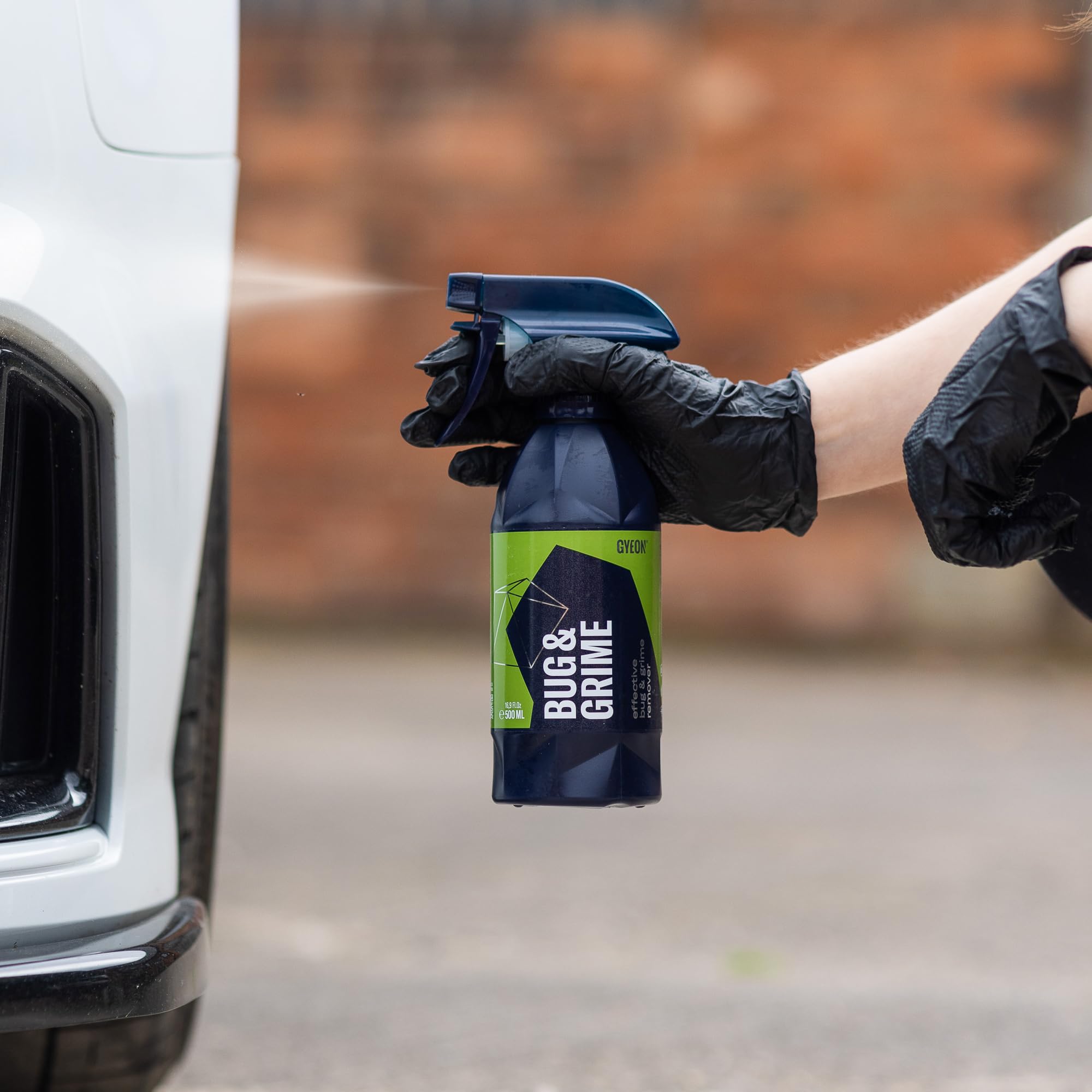 Gyeon being wiped with microfiber showing streak-free finish