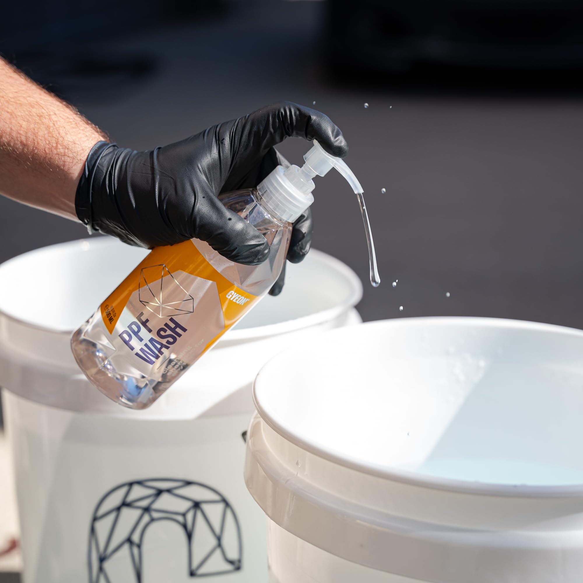 Gyeon PPF Wash suds lifted by wash mitt showing scratch-minimizing lubrication