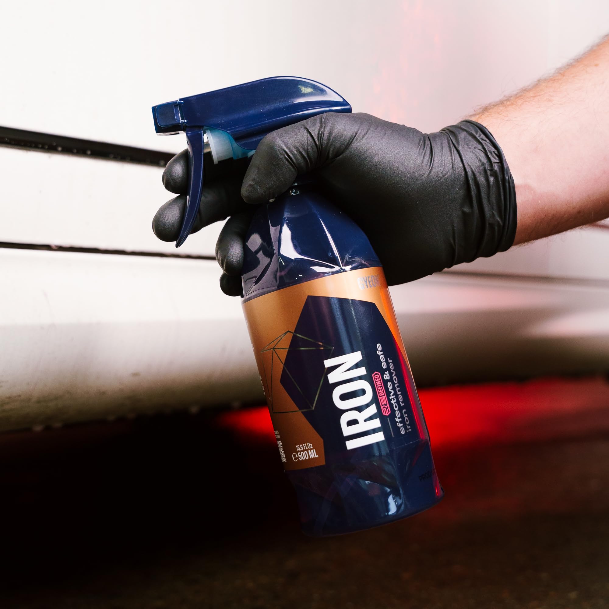 GYEON bottle placed on car hatch demonstrating ready-to-use convenience