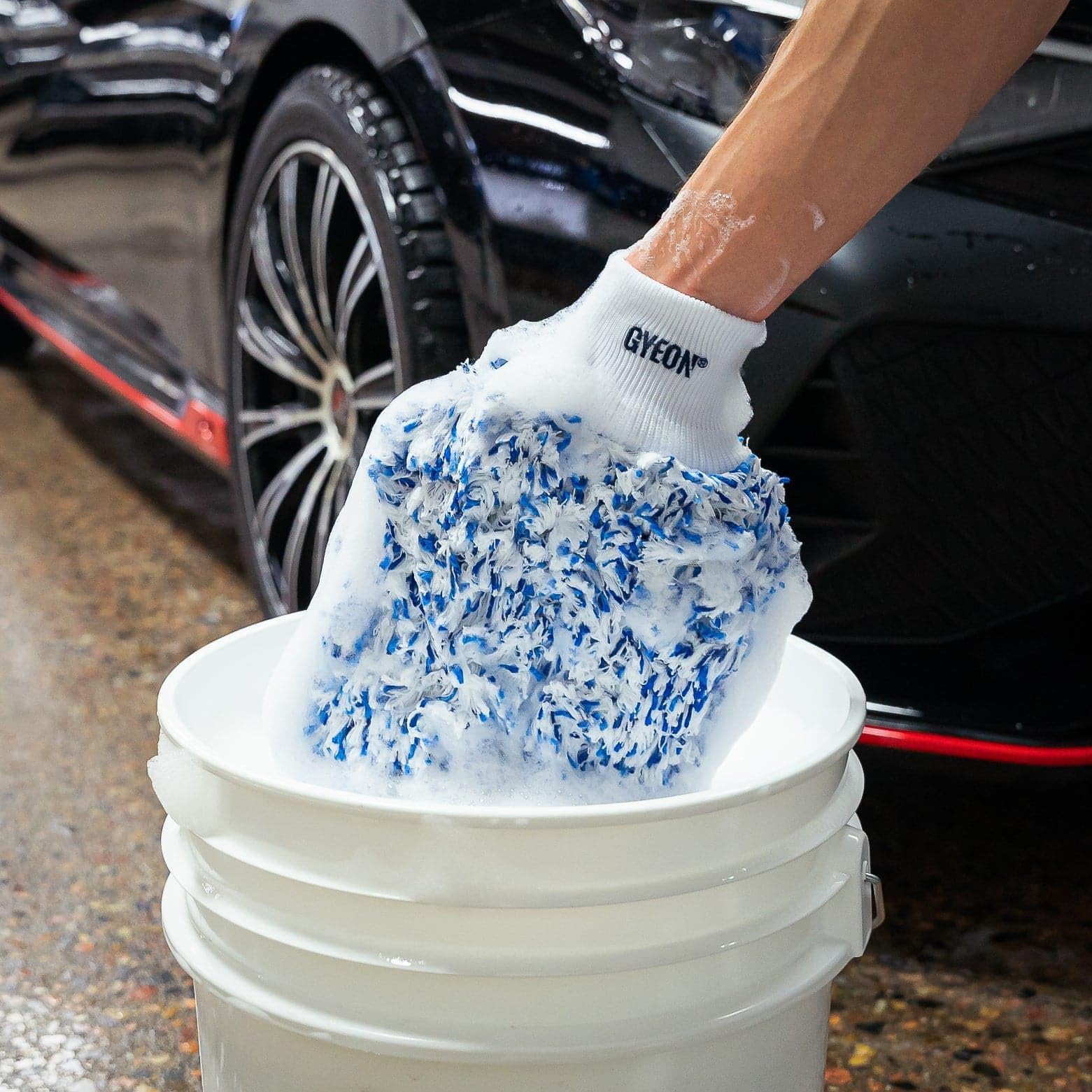 Gyeon mitt in hand showing true scale and secure fit advantage