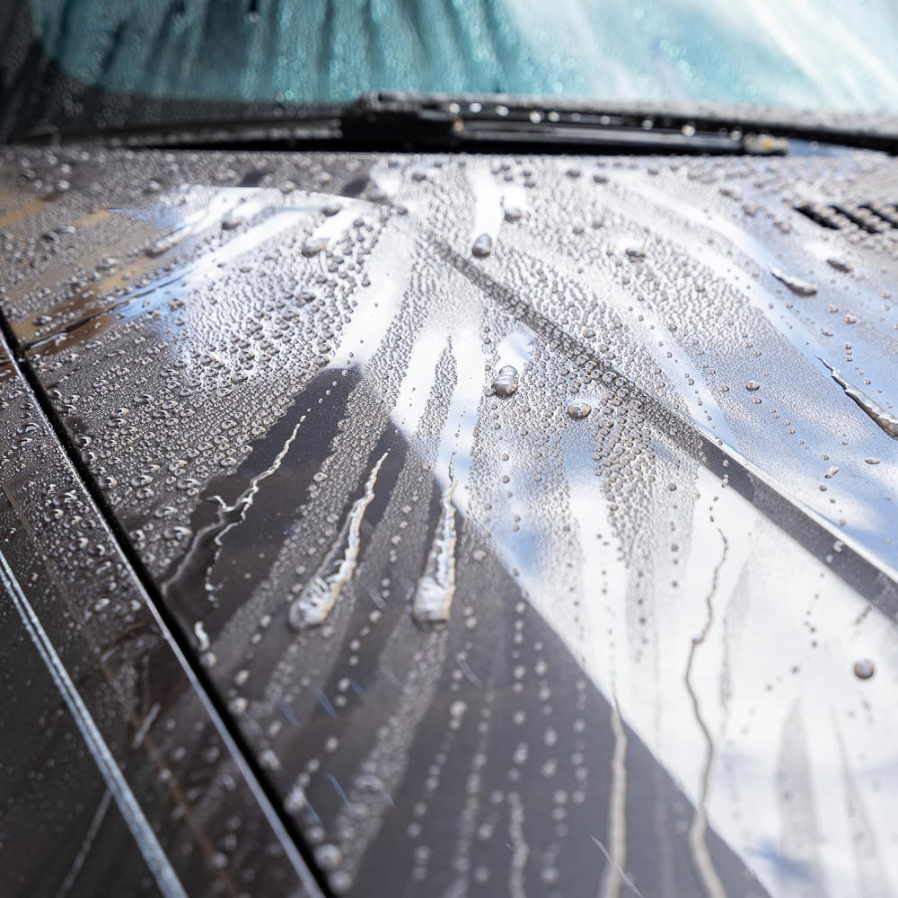 GYEON wet coat on car in outdoor setting illustrating hydrophobic protection