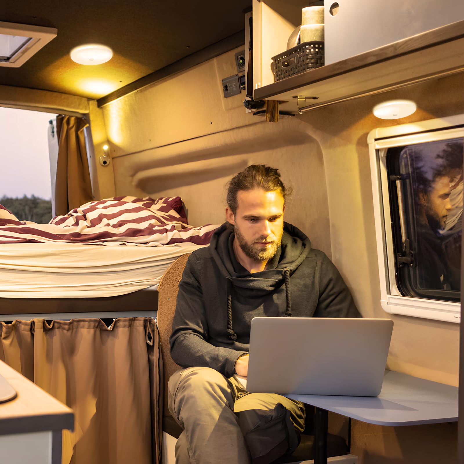 GZV lifestyle shot in retro camper highlighting cozy, adjustable interior lighting