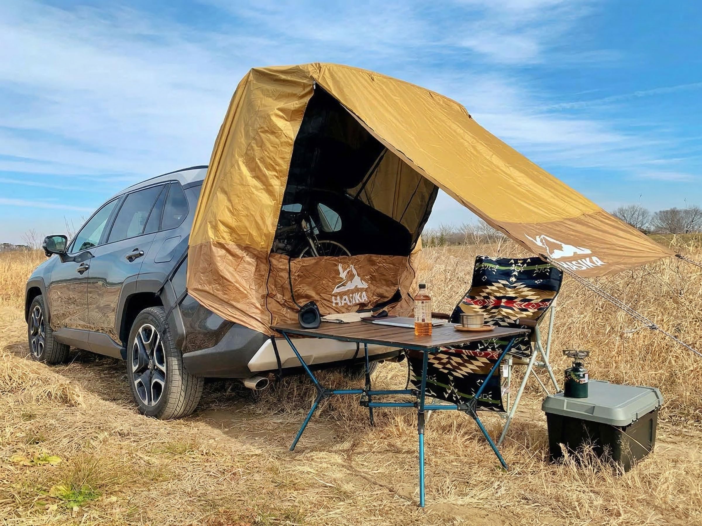 HASIKA tent beside SUV showing scale and 110+ square feet of shade