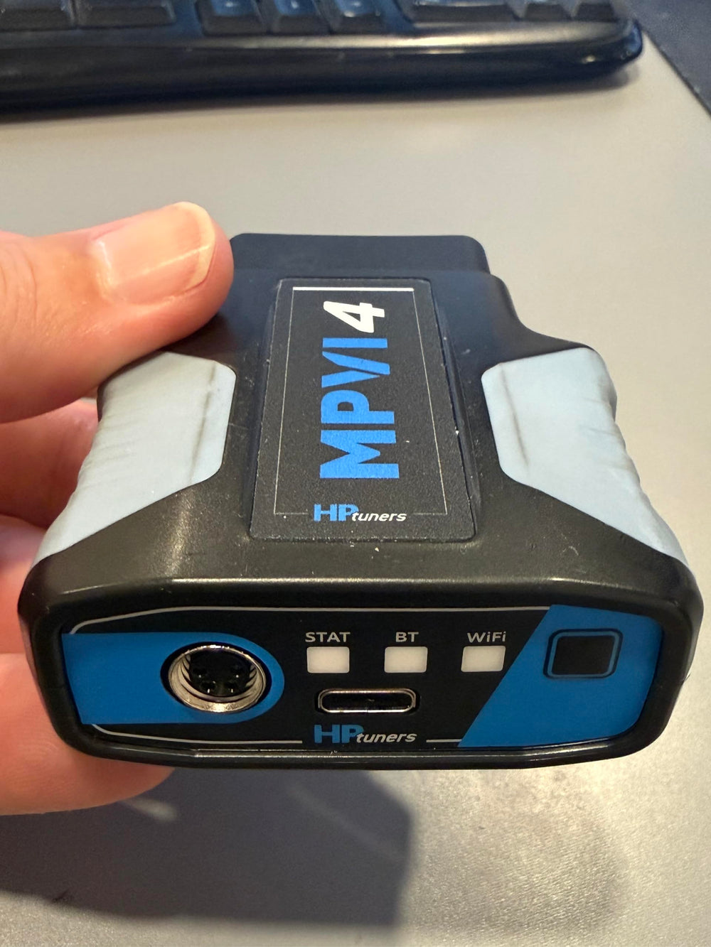 Hinson MPVI4 beside smartphone showing compact size and portability benefit