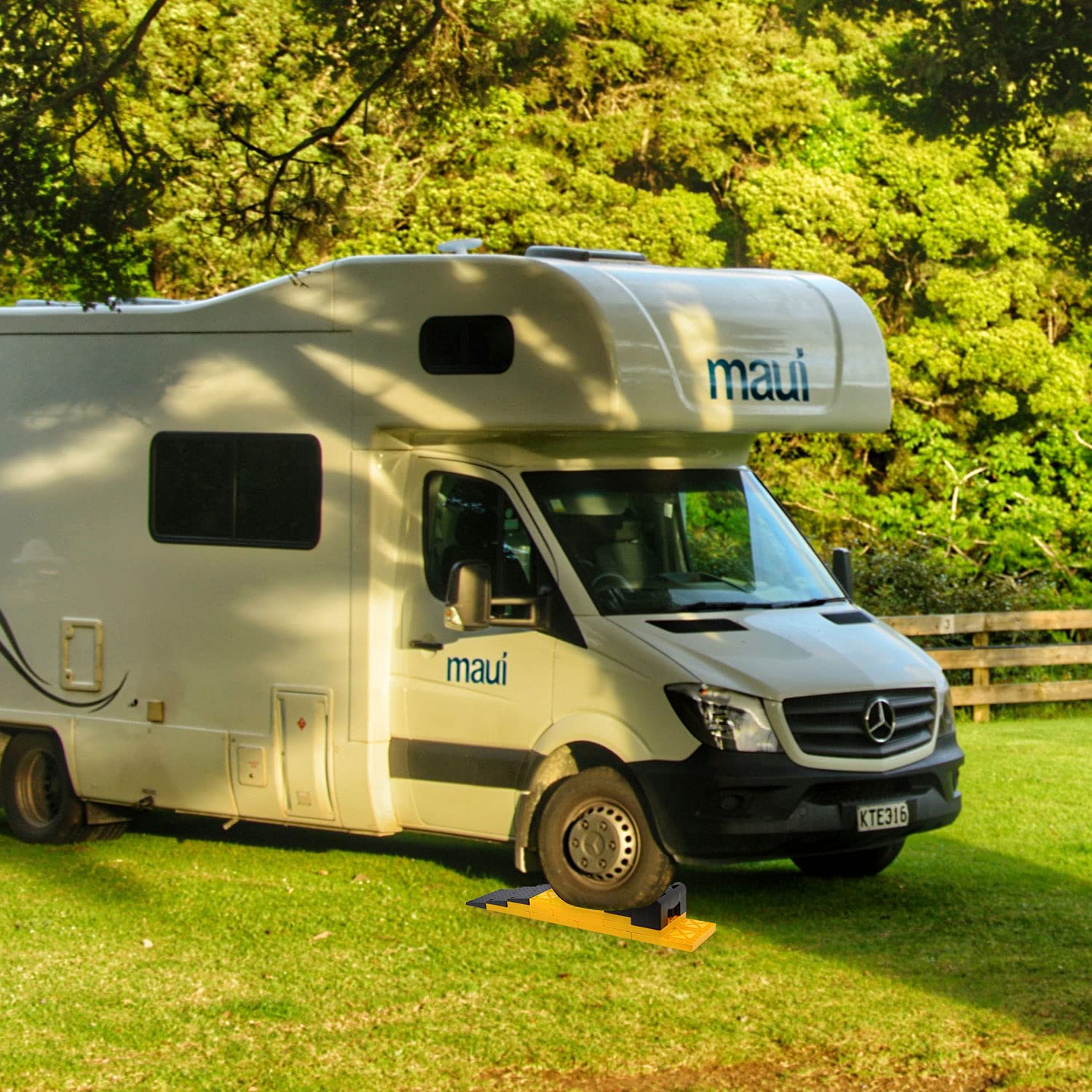 Homeon Wheels in use under RV tire providing quick campsite leveling