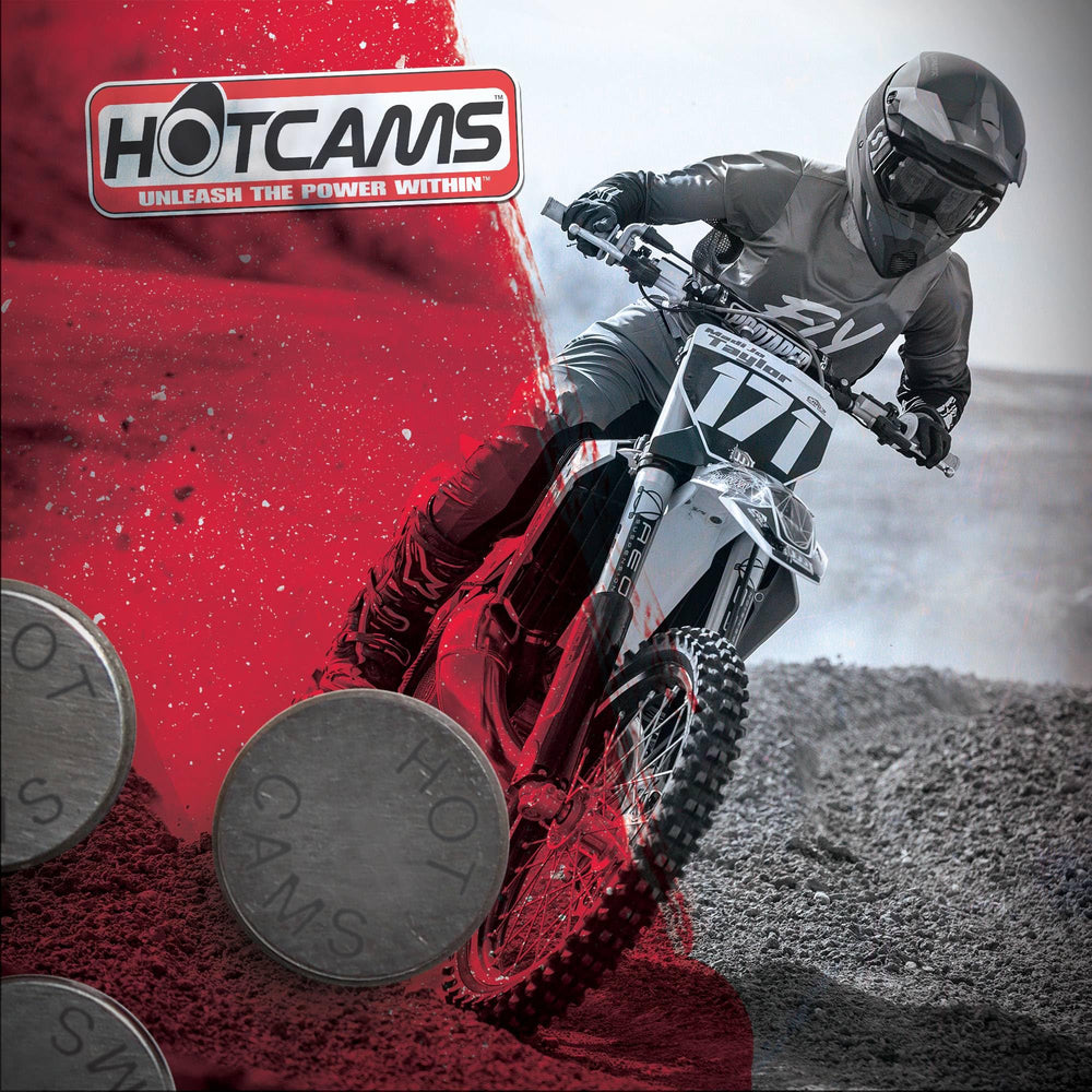 Hot Cams shim kit beside an ATV cylinder head to show compatibility and scale