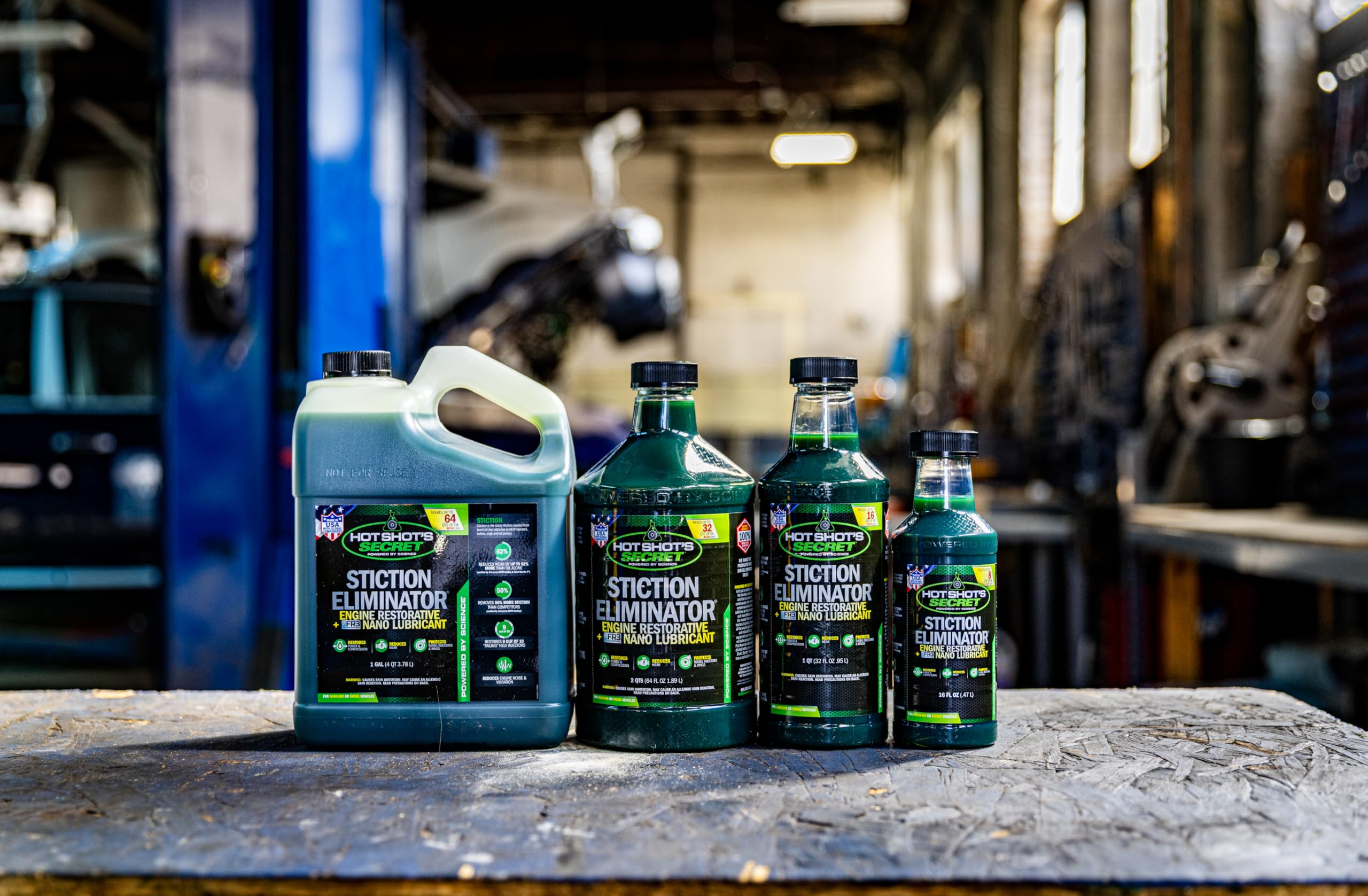 Hot Shot's Secret bottle on mechanic workbench showing professional maintenance use