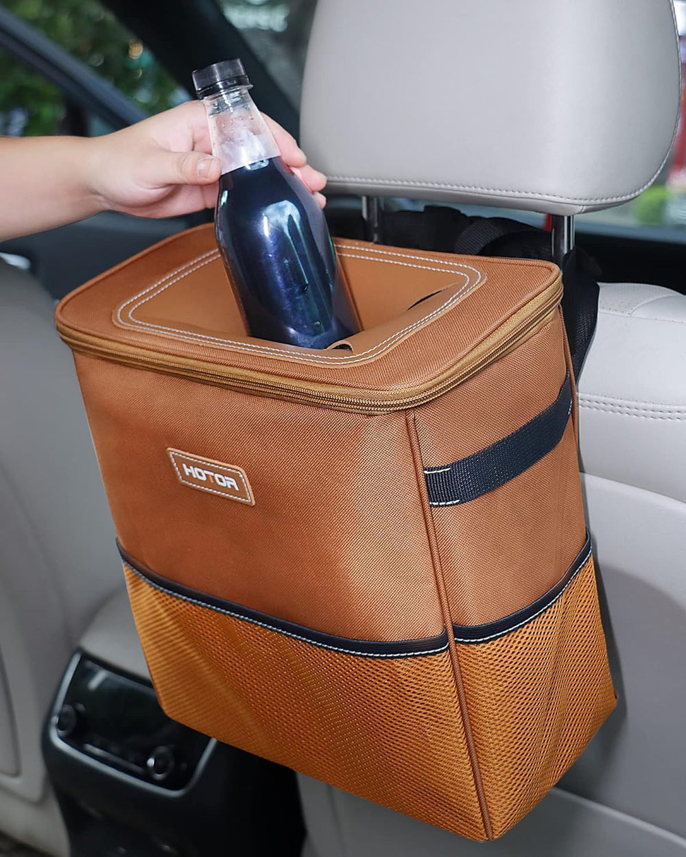 HOTOR open top showing roomy capacity holding wrappers and bottles for clutter control