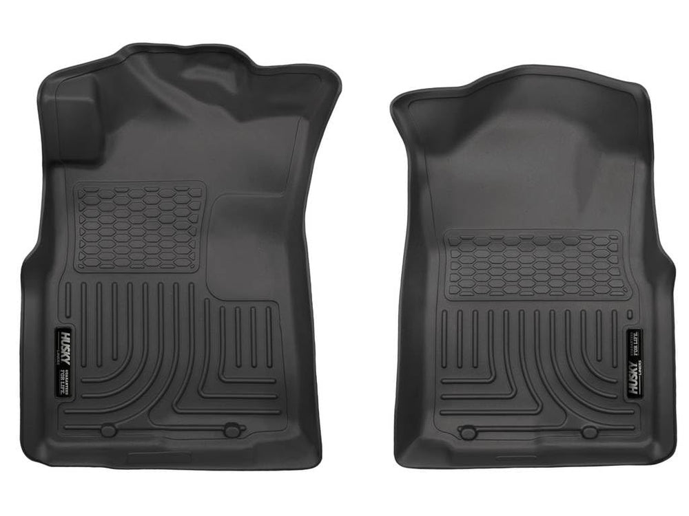 Husky Liners driver-side mat showing precise fit and floor protection
