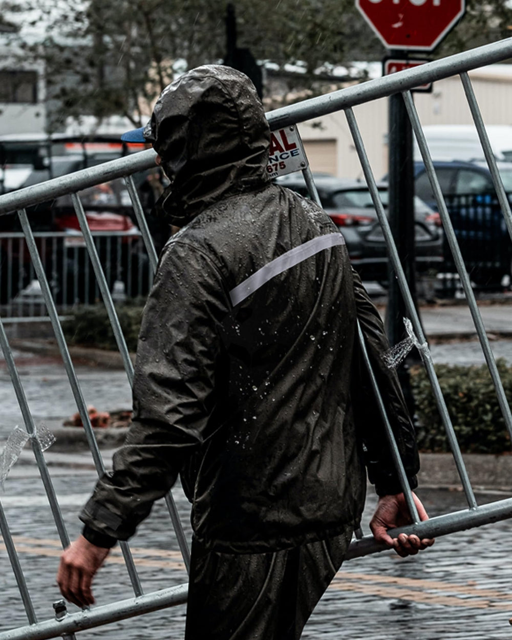 iCreek raincoat worn outdoors showing durable protection benefit