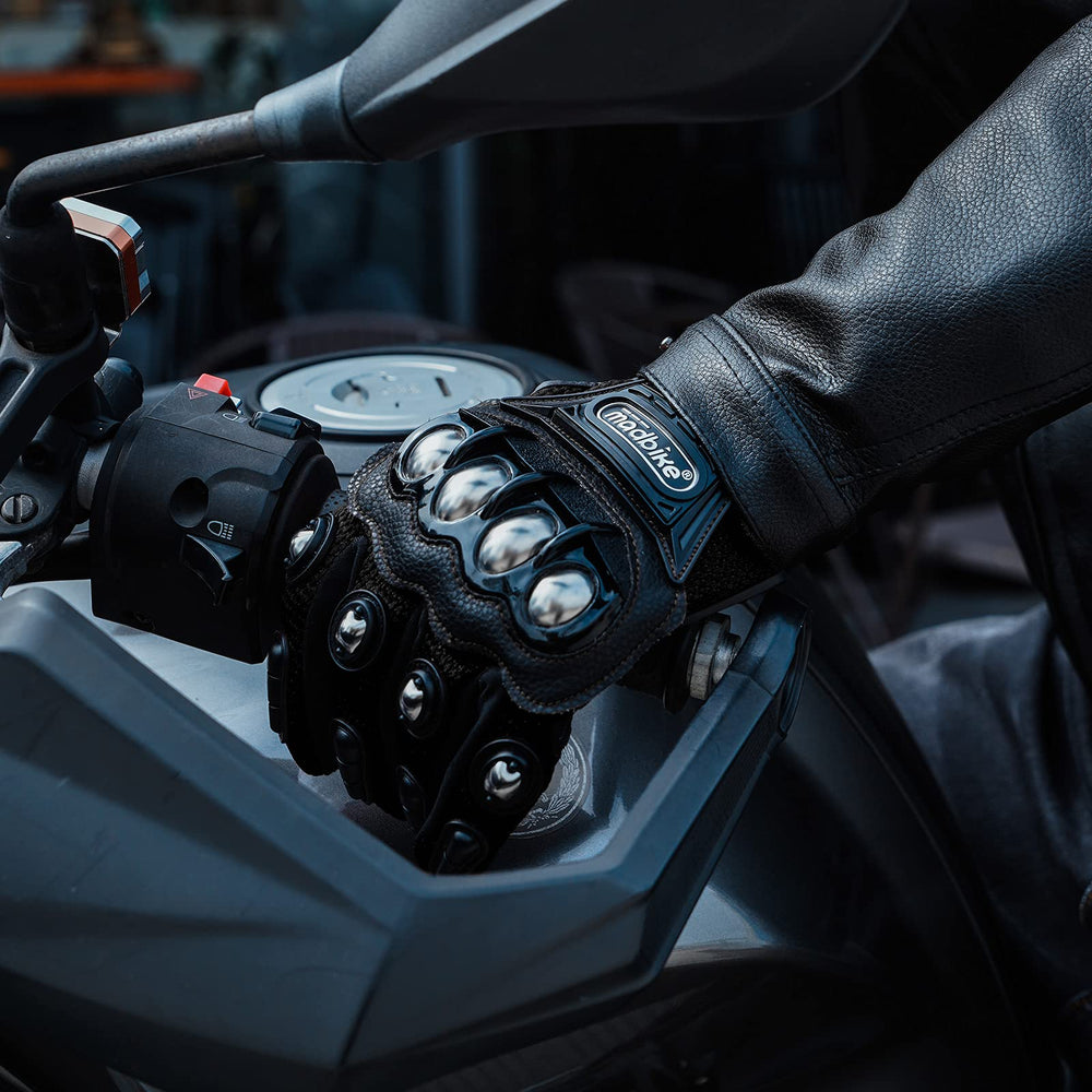 ILM glove beside a hand and helmet showing size and real-world scale