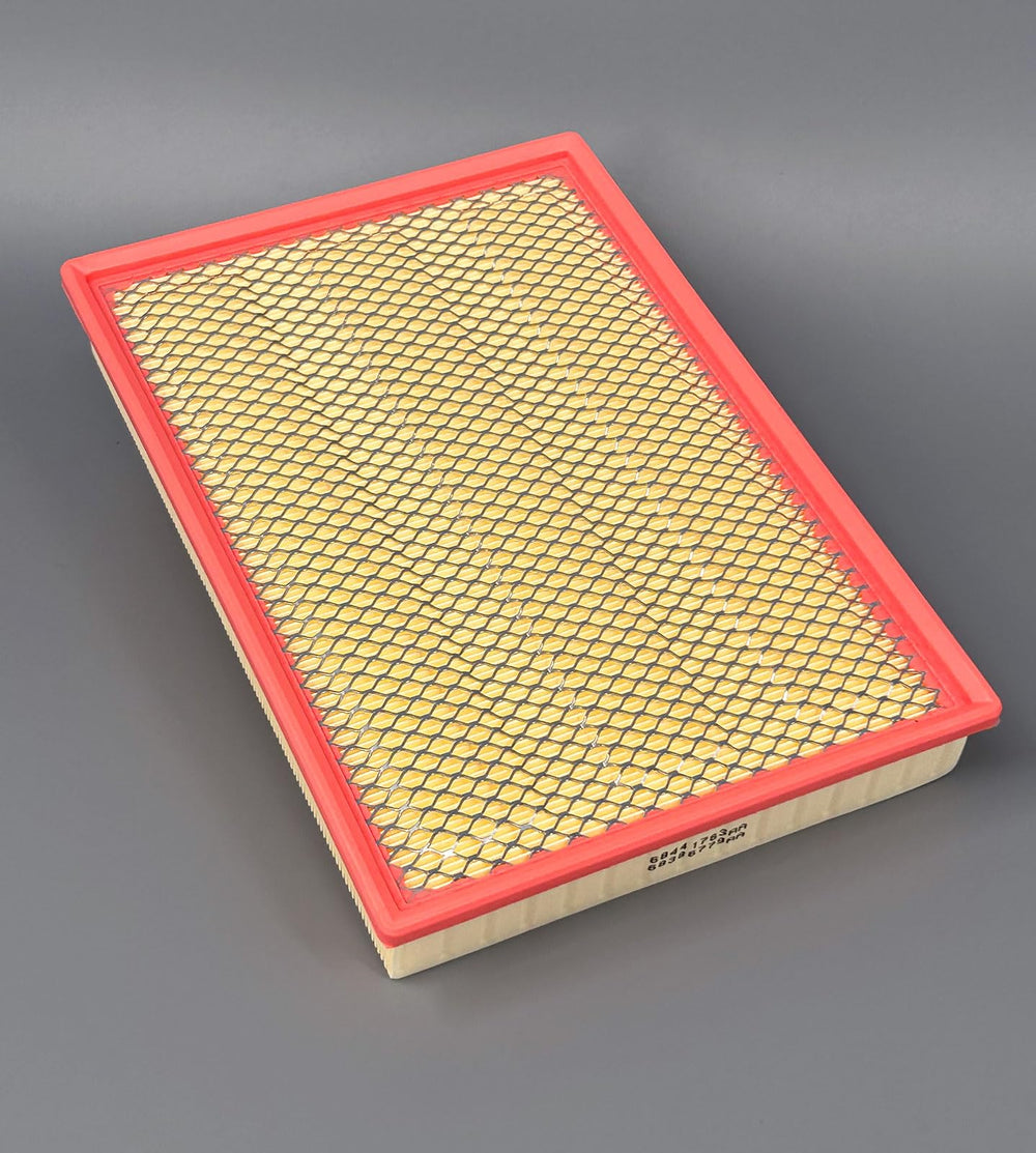 ITESIER cabin filter beside a ruler in glovebox showing size and scale