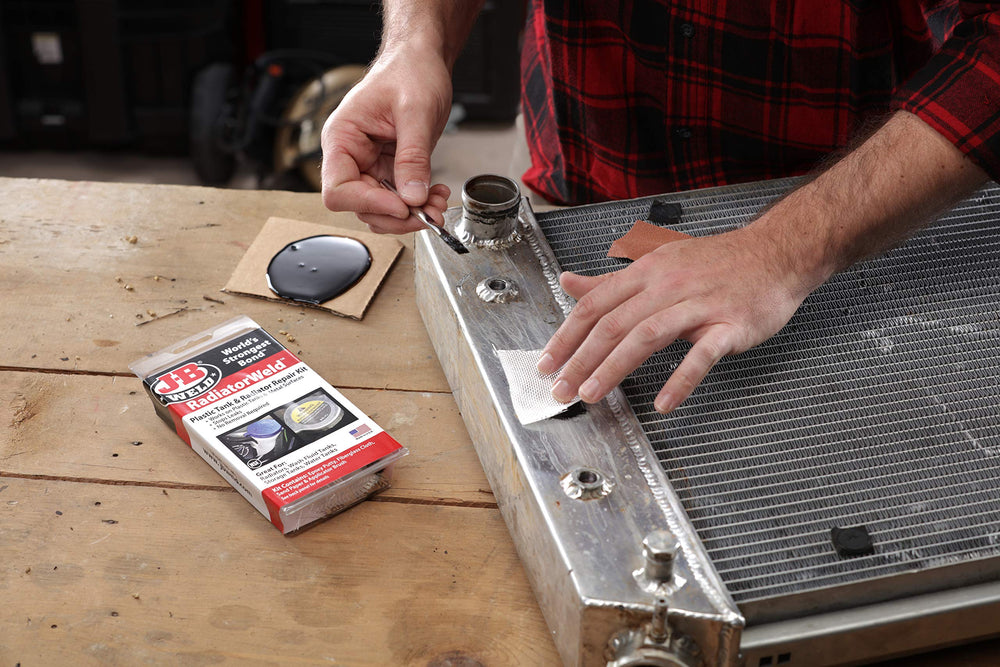 J-B Weld 2120 kit contents laid out for scale and quick identification before use