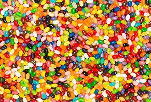 Jelly Belly beside a coin for scale showing compact discreet size
