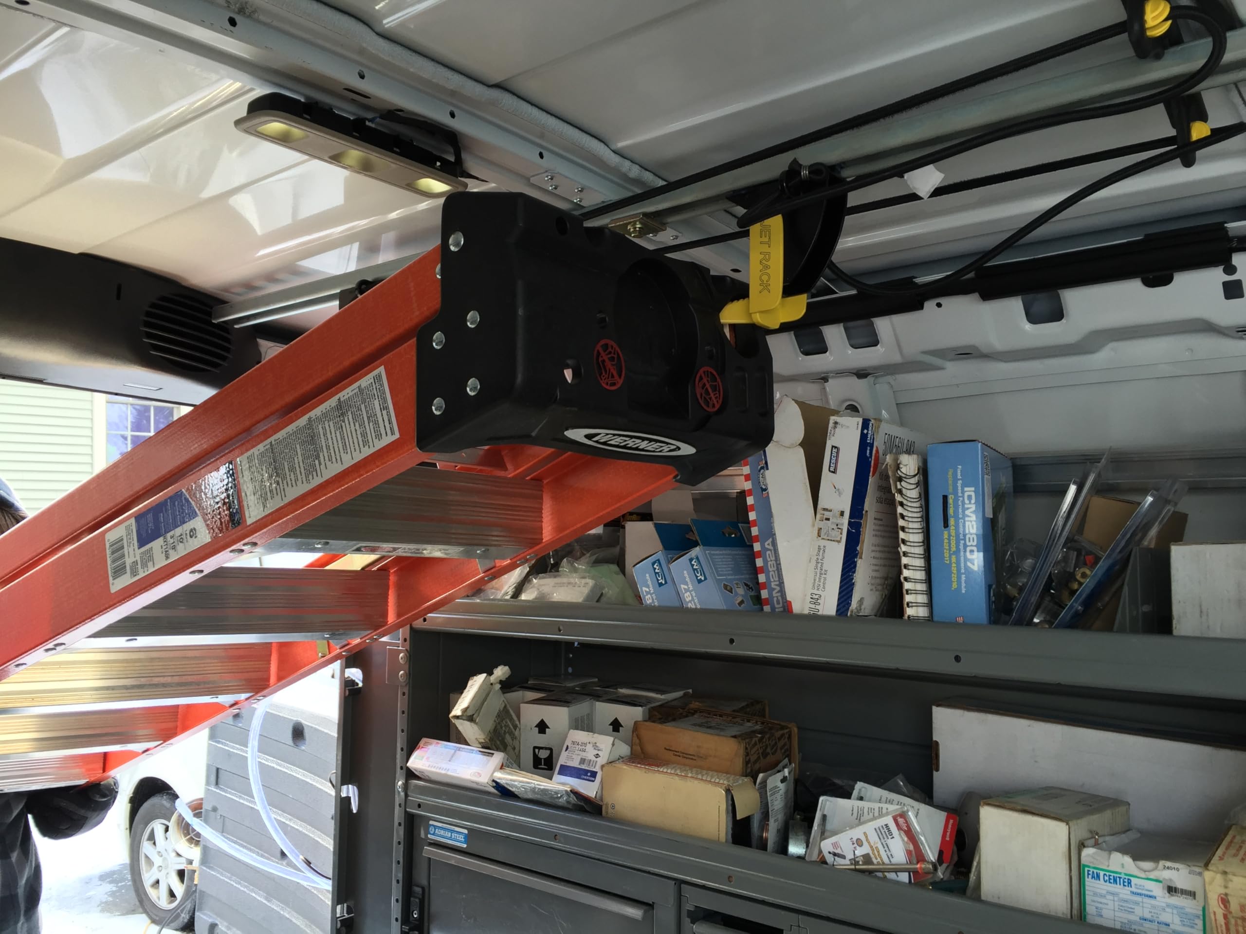 JET Rack mounted on van ceiling illustrating space-saving storage benefit