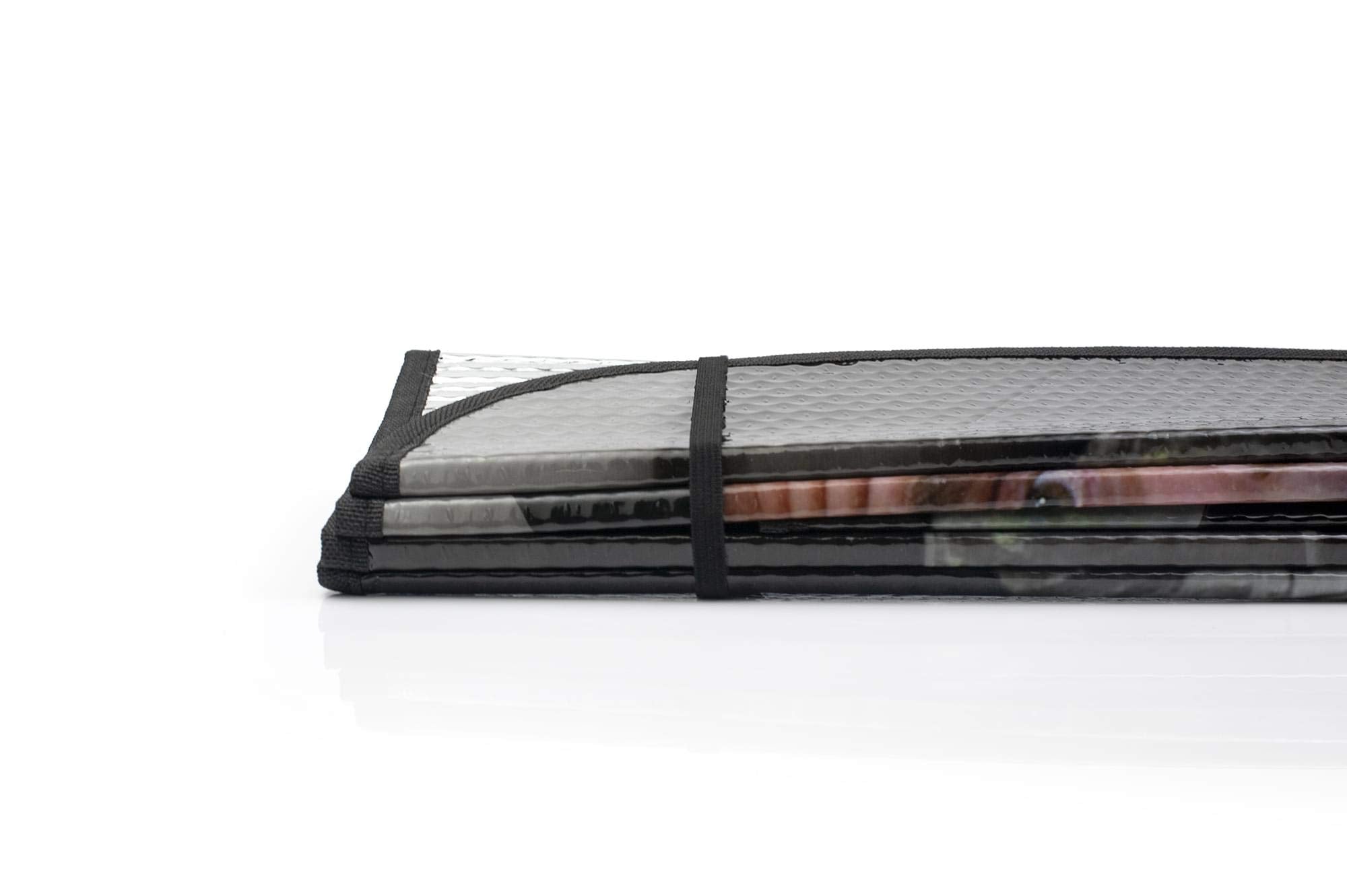 JUST FUNKY sun shade folded compactly for easy storage in glovebox or trunk