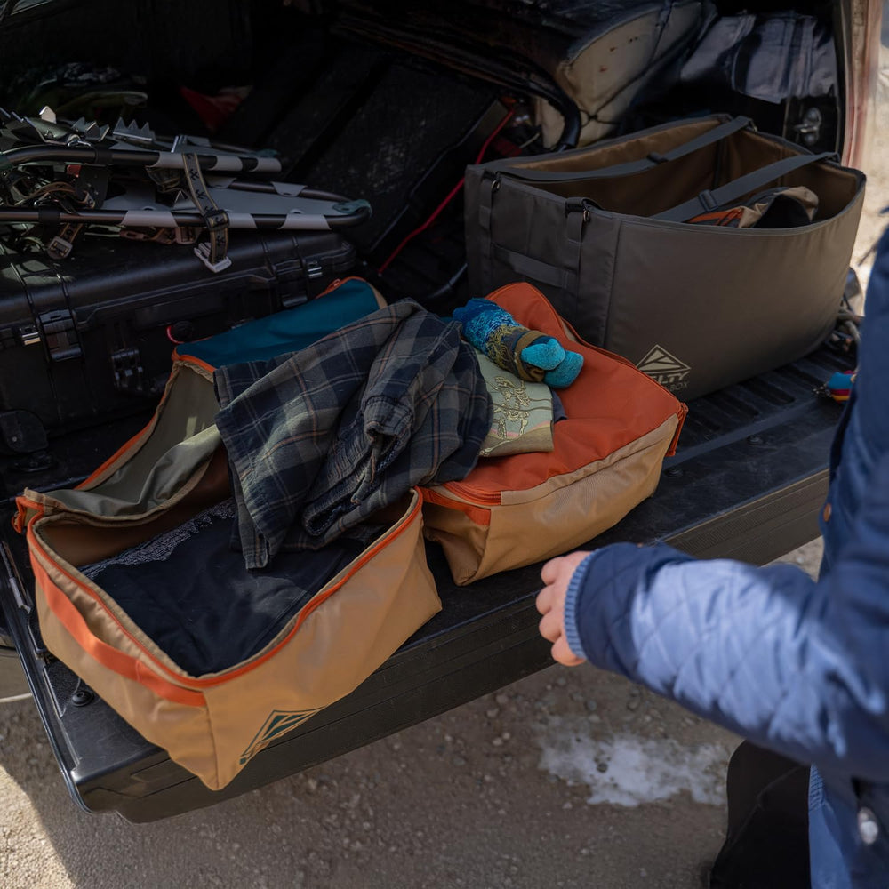 Kelty adjustable straps shown in carry and compression configurations
