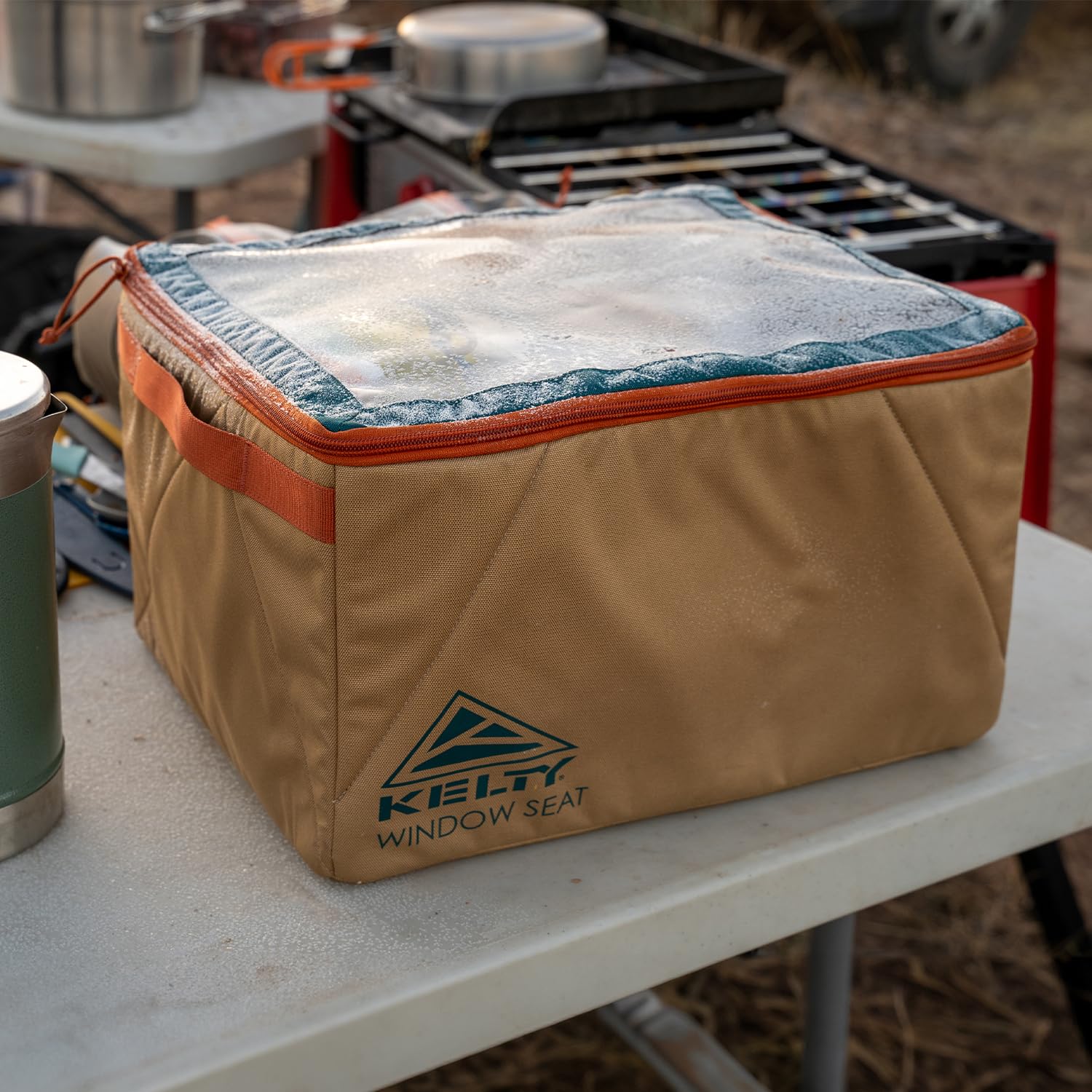 Kelty Window Seat size compared with water bottle shows real-world scale